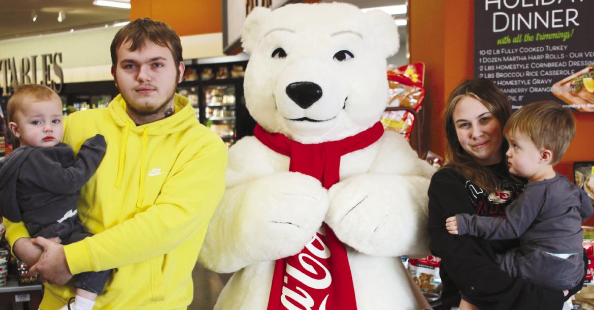 Kaison, CJ, Delia and Arrow Barber enjoy the festivities at a local food store in Richmond. The Coca-Cola Polar Bear made its appearance in Ray County along with Santa Claus and the Grinch. SOPHIA BALES | Staff