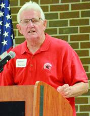 RICHMOND HIGH SCHOOL alumnus Norman Bowman mixes levity, stats and seriousness as he inducts the 1962 varsity football team recently into the Richmond High School Athletic Hall of Fame. SHAWN RONEY | Staff