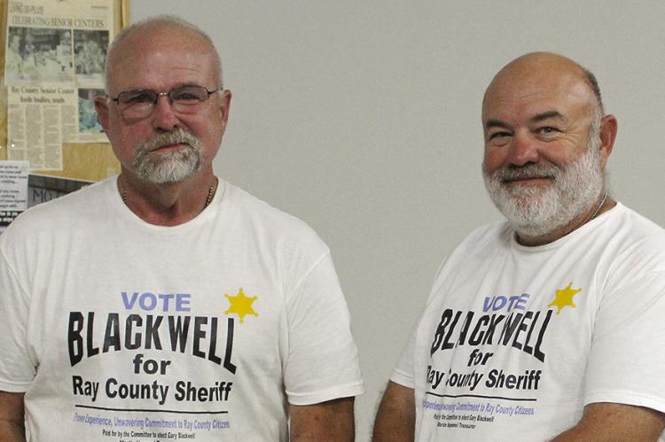 RAY COUNTY SHERIFF candidate Gary Blackwell (left) stands with proposed undersheriff Randy Miller after speaking with the crowd. SHARON DONAT | Staff